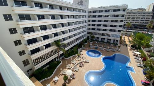 an aerial view of a hotel with a swimming pool at Coral Suites & Spa - Adults Only in Playa de las Americas