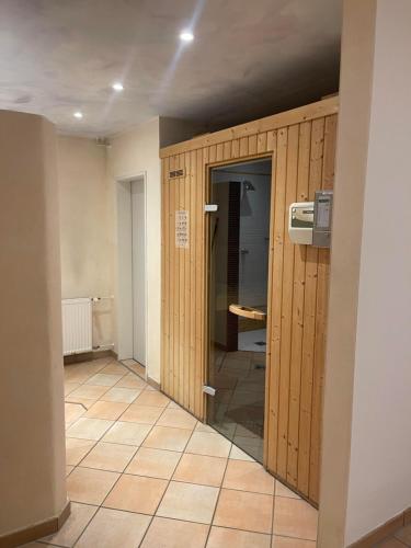 a hallway with a glass door in a room at Ferienwohnung Hörnernest in Bolsterlang
