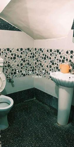 a bathroom with a toilet and a sink at SGroom in Amritsar
