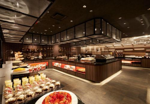 a restaurant with a buffet of food on display at Sunshine City Prince Hotel Ikebukuro Tokyo in Tokyo