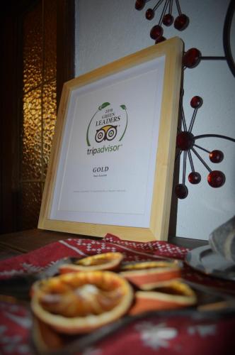 a framed picture of apples and oranges on a table at Haus Susanne in Radstadt