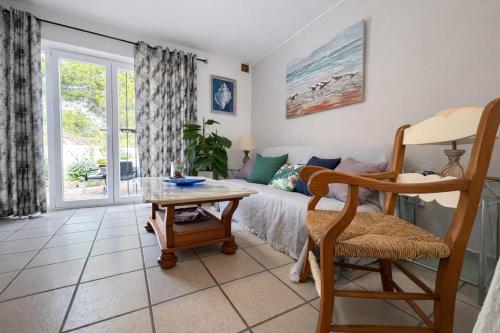 a living room with a couch and a table at Luxury House - Montesol ALBERT VILLAS in Alcossebre