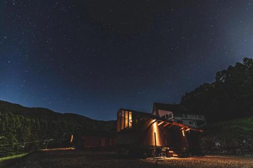 a house at night with a starry sky at Earthboat Minakami Hodaigi in Minakami