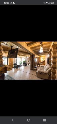 two pictures of a living room with a couch at Casa Hiru in Nucşoara