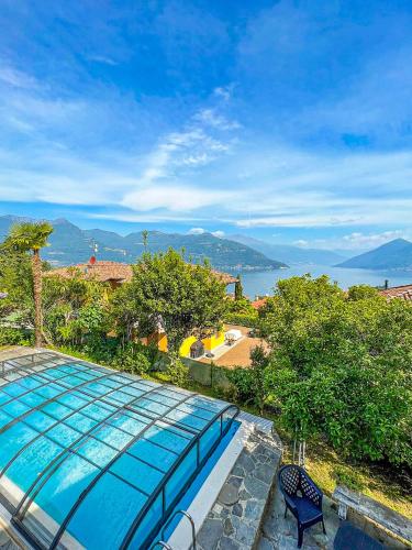 a swimming pool with a view of the water at Casa Lago in Germignaga