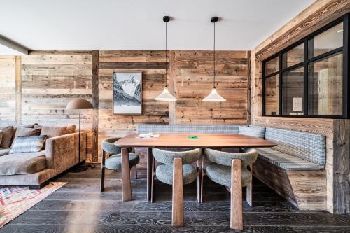 a dining room with a table and chairs at Apartment Clano, Châtel - by EMERALD STAY in Châtel