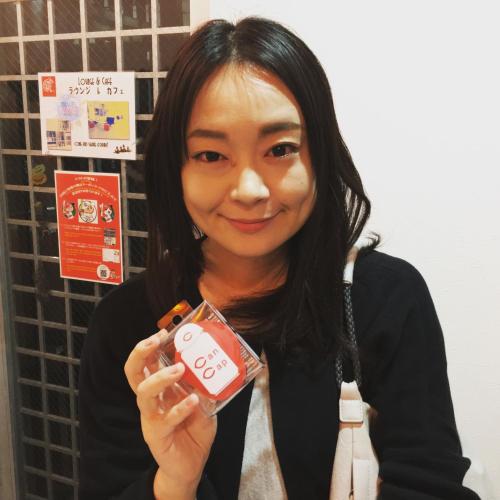 a woman is holding a toy in her hand at OUCHI HOTEL Yokogawa in Hiroshima