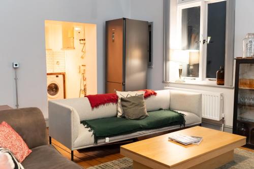 a living room with a couch and a coffee table at High living @ Ferguson Court in Carlisle