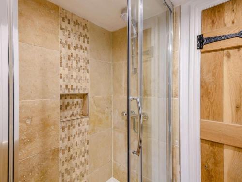 a shower with a glass door in a bathroom at 2 Bed in York oc-91049 in Kirkbymoorside