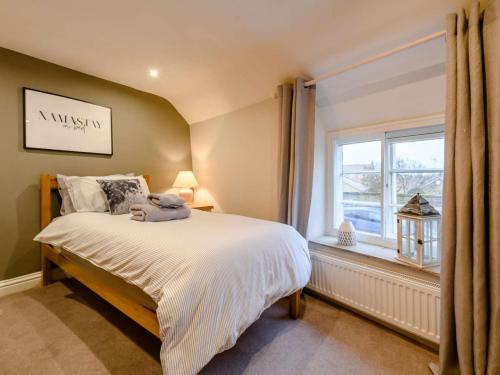 a bedroom with a bed and a window at 2 Bed in York oc-91049 in Kirkbymoorside