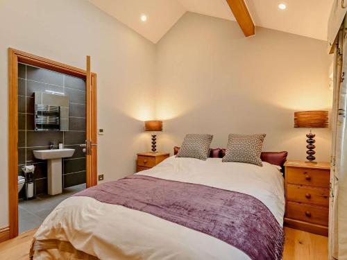a bedroom with a large bed and a sink at 1 Bed in Halifax oc-90213 in Sowerby Bridge