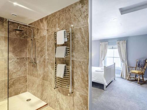 a bathroom with a shower and a bedroom at 2 Bed in Harrogate oc-88933 in Pateley Bridge
