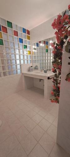 a bathroom with a sink and a mirror at Casa Blu Mare privat beach 9 person in San Nicola Arcella