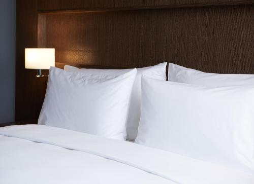 Postel nebo postele na pokoji v ubytování Dusit D2 Kenz Hotel Dubai
