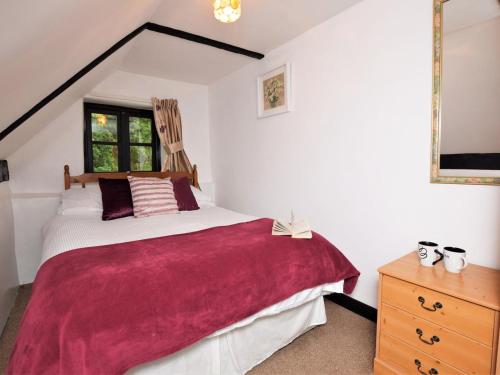 a bedroom with a large bed and a window at 2 Bed in Bridgwater oc-alden in Kilve