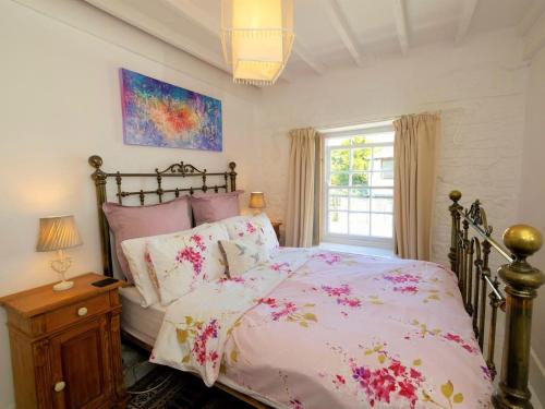 a bedroom with a bed and a window at 4 Bed in Godshill oc-ic034 in Godshill