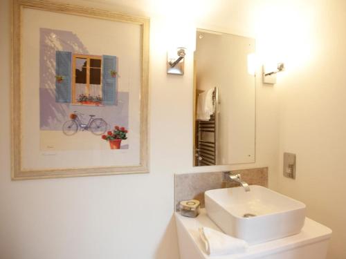 a bathroom with a white sink and a mirror at 2 Bed in Harrogate oc-75642 in Summer Bridge