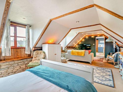 a bedroom with a bed and a living room at 1 Bed in Wedmore oc-51340 in Chapel Allerton