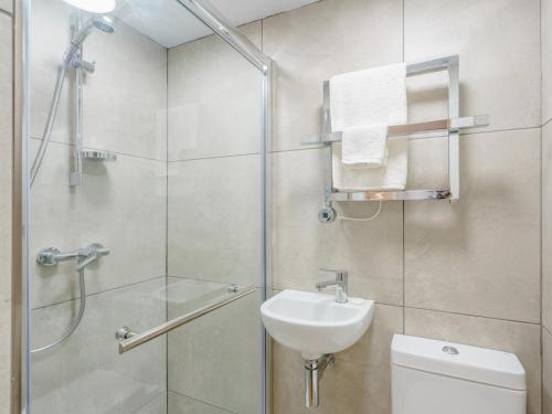 a bathroom with a shower and a toilet and a sink at 1 Bed in Skipton oc-78576 in Skipton