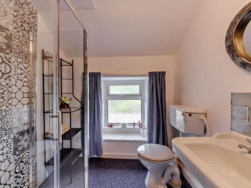 a bathroom with a toilet and a sink and a window at 2 Bed in Consett oc-92807 in Hunstanworth