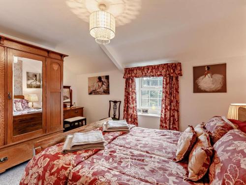 a bedroom with a large bed and a window at 2 Bed in Consett oc-92807 in Hunstanworth