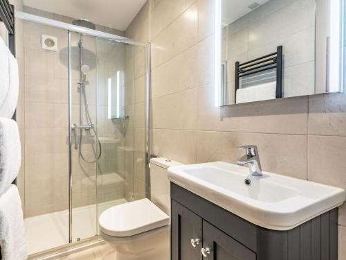 a bathroom with a sink and a toilet and a shower at 2 Bed in York oc-84000 in Crayke