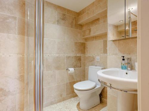 a bathroom with a toilet and a sink at 1 Bed in Wedmore oc-51341 in Chapel Allerton