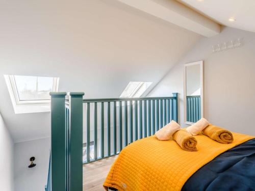 a bedroom with a bed with towels on it at 1 Bed in Lymington oc-81429 in Lymington