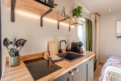 a kitchen with a sink in a tiny house at 1 Bed in Austwick oc-b37509 in Austwick