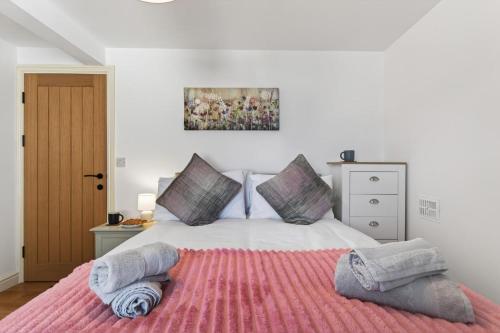 a bedroom with a large bed with pillows on it at 2 Bed in Aberystwyth oc-c36918 in Aberystwyth