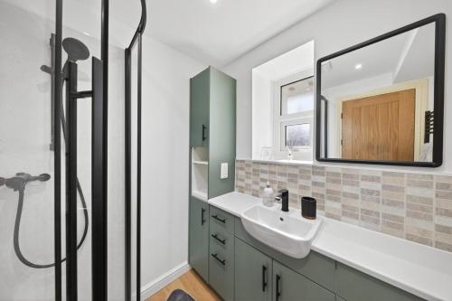 a bathroom with a sink and a mirror at 2 Bed in Aberystwyth oc-c36918 in Aberystwyth