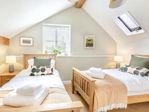 two beds in a bedroom with a roof at 2 Bed in Taunton oc-88884 in Isle Brewers