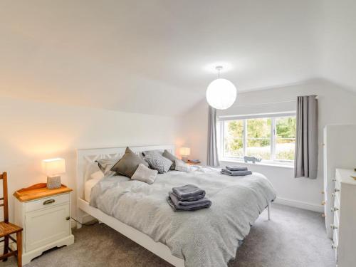 a bedroom with a white bed and a window at 2 Bed in Malton oc-78794 in Norton