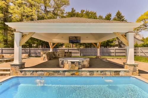 a gazebo with a pool in a backyard at Beachside family POOLSPAOPEN20thAPril in Barnstable