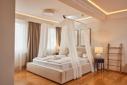 a bedroom with a bed with a canopy at I AM HOTELS Graz-Seiersberg in Graz