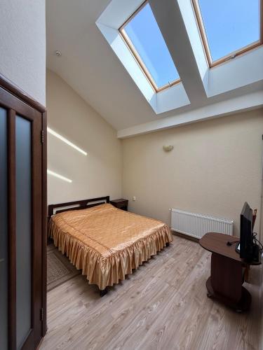 Postel nebo postele na pokoji v ubytování Troyanda