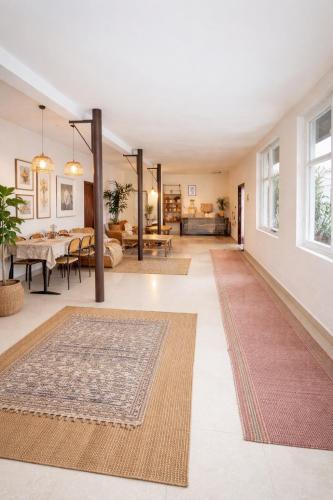 a living room with two rugs on the floor at Gokor Guesthouse in Dilijan