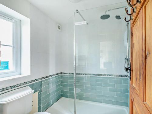 a bathroom with a shower and a toilet at 1 Bed in Sherborne oc-93804 in Yetminster