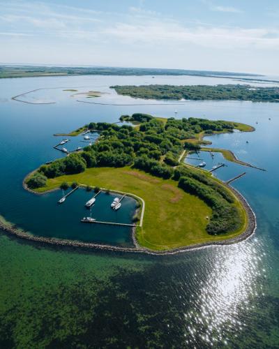 an aerial view of a small island in the water at Ouddorp Connection Guesthouse in Ouddorp