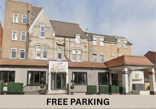 a building with the words free parking in front of it at The Continental Hotel, Derby in Derby