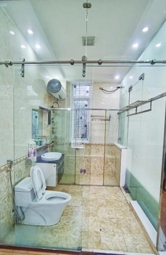 a bathroom with a toilet and a sink and a shower at Hà Chi Villla Hà Giang in Ha Giang