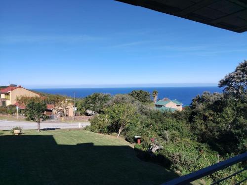 a view of the ocean from the balcony of a house at Ce-la-vie in Gqeberha