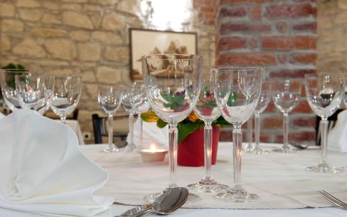a bunch of wine glasses sitting on a table at Hotel Varazdin in Varaždin