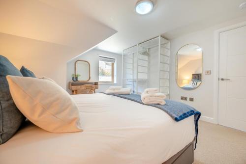 a bedroom with a large white bed with two towels at 4 Bed in Newquay oc-b27906 in Newquay