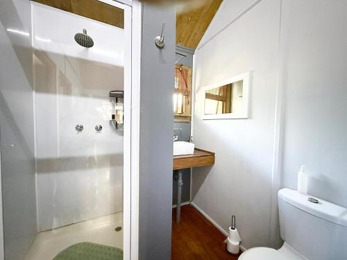 a bathroom with a toilet and a sink at Hippo Waterfront Lodge in Nelspruit
