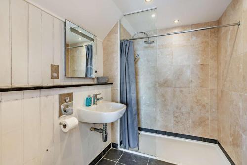 a bathroom with a sink and a shower at 2 Bed in Croyde oc-r27591 in Croyde