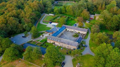 an aerial view of a large building in a park at Beech Cottage - Spacious Cottage with Pool Near Coastal Trails in HAW