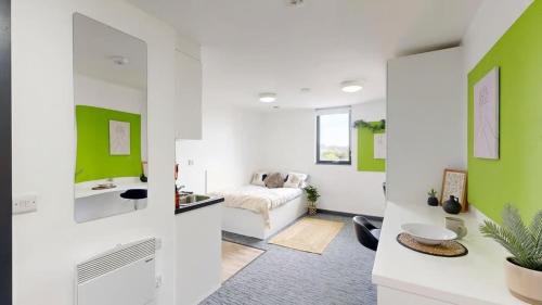 a living room with green and white walls at For Students Only Glassworks in Liverpool in Liverpool