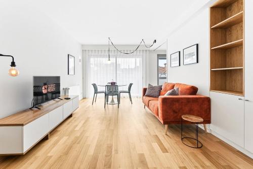 a living room with a couch and a table at GuestReady - Menéres Apartments in Matosinhos