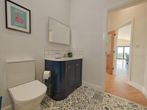 a bathroom with a toilet and a sink at 2 Bed in Stanton oc-p30248 in Ticknall